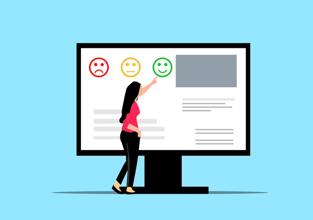Person vor einem Bildschirm mit grünem, gelbem und rotem Smiley. Beispielbild für die Teilnahme an einem Online-Fragebogen zur fortlaufenden Evaluation zur Bürgerbeteiligung in Wuppertal